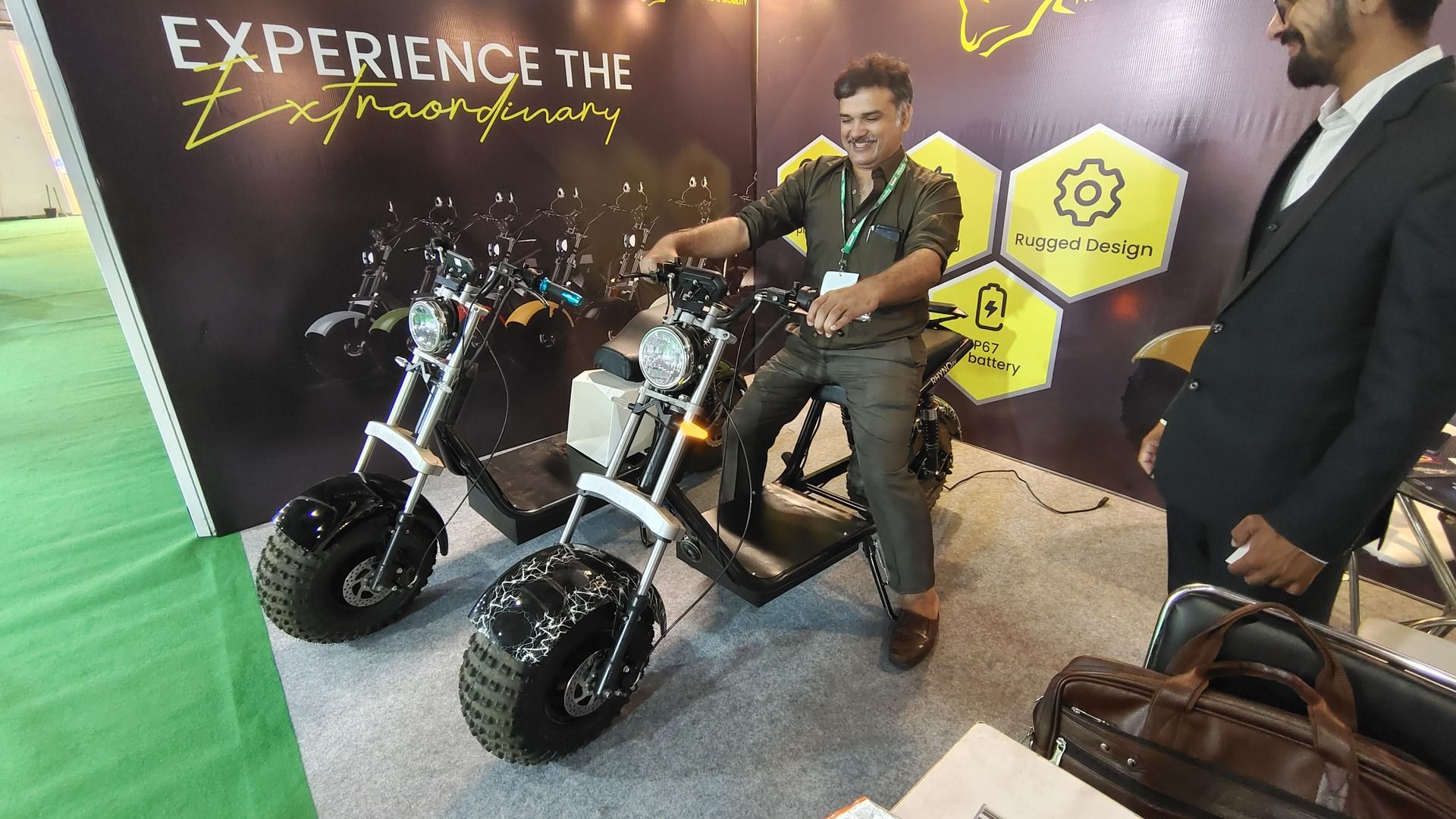 Attendees enjoying the Rhyno electric scooter at the India eMobility Show 2023 (Green Wheels India)