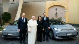 Pope Francis with Volkswagen officials and the VW ID.3 and ID.4 electric cars