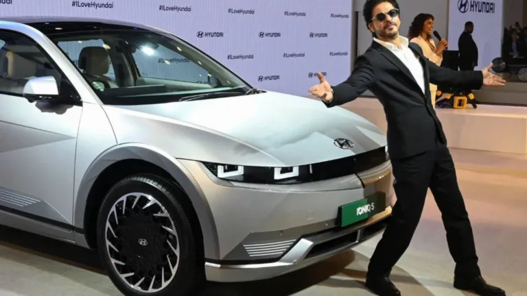 Shah Rukh Khan posing in front of his Hyundai Ioniq 5