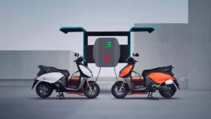 Two Hero Vida electric scooters on charging