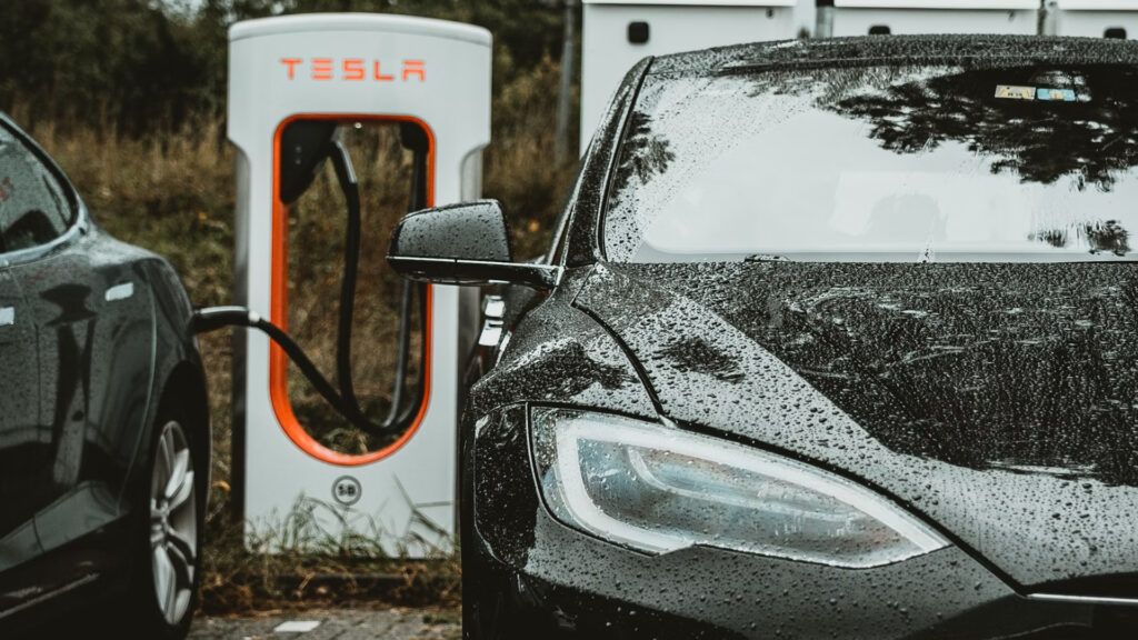 Tesla car charging during rainy day