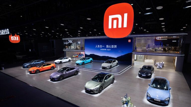 Xiaomi SU7 showcased at an event (Source: Xiaomi)