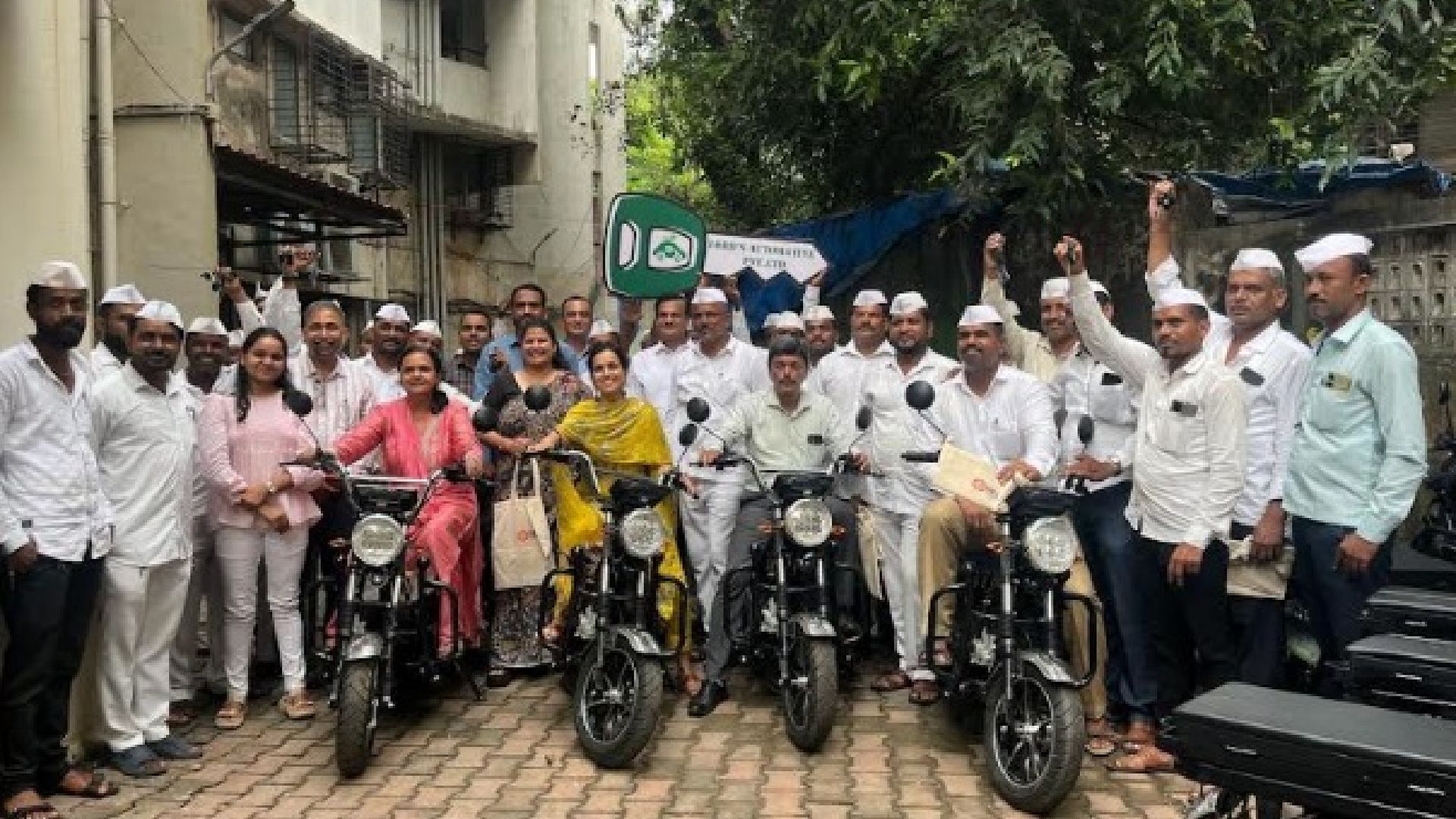 Mumbai Tiffin Box Association workers with Lord Automotive Electric Motorcycles